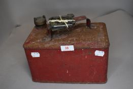 A vintage petrol can and an RAC engine hood badge