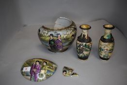 A Chinese or Japanese export bowl extensivly decorated with natural landscape and realistic geisha