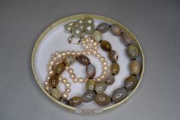 A string of baroque style cultured pearls, over sized simulated pearl and yellow wire necklace and a