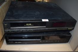 Two vintage VHS video cassette players