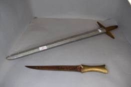 A Eastern Dagger possibly Jambiya having brass handle, blade length 25cm overall length 35cm along