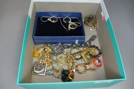 A selection of costume jewellery including yellow metal brooches and a matching set of ear rings and