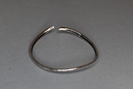 A narrow silver bangle marked 925 being sold for the shoebox appeal charity