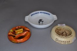 Three vintage cigarette ashtrays two having advertising prints