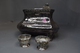 A silver plated tea caddy by Skinner & Co having moulded floral decoration and bracket feet, no