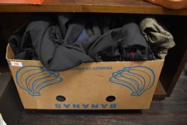 A box full of gents vintage and retro clothing including suit jackets, trousers and more.