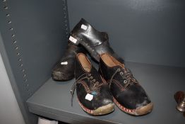 Two pair of traditional wooden sole and leather clogs