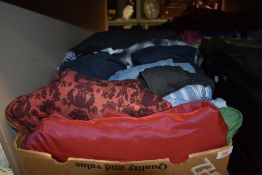 A box full of ladies wear including ball gown, shirts,jeans, dresses and more.