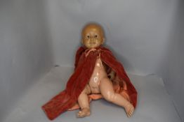 A vintage childrens toy doll