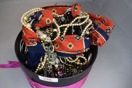 A selection of costume jewellery including bangles, strings of beads etc