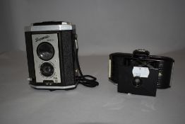 A Kodak Brownie Reflex camera and a Kodak Bantam camera