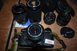 A Praktica B100 with Carl Zeiss 28mm lens, Pentaco 35-70mm zoom, Praktica 70-210mm zoom, Pentacon