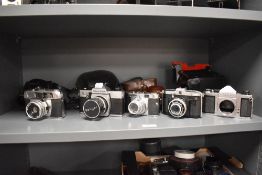 Five cameras. An Agasi Pentax ST, a Ferrania, a Voigtlander, a Praktica TLB and a Helina