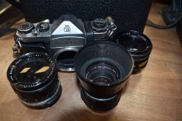 An Asahi Pentax camera body with Super Takumar 55mm, Optima 35mm, and Solidar 22mm lens