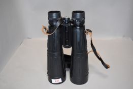 A pair of Optolyth 63 x 8 binoculars in leather case