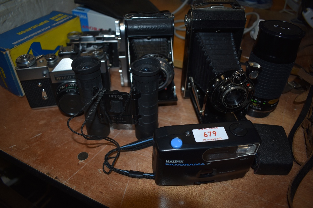 A selection of cameras and binoculars including Balda Baldix, Zenit Prinzflex 500, Voightlander Vito