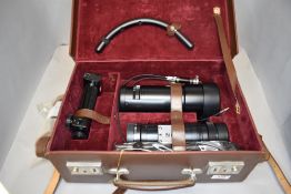 A brown leather case containing a Leitz Westler Telyt 400mm lens and an extention tube etc