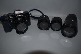 A Minolta 7000AF camera with Minolta 50mm, 70-210mm zoom, 49mm and 35-70mm zoom lenses Minolta Flash