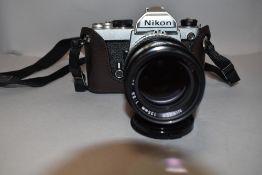 A Nikon FM camera with Nikkor 50mm lens, Hanimax 28mm wide angle lens, Paragon 500mm lens etc all in