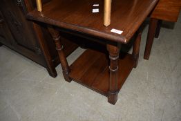 A late C20th oak low/occasional table, having square top and turned legs
