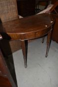 A reproduction Regency style demi lune hall table, fold over top with fitted interior, width approx.