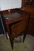 A C19th mahogany night stand, having scallop ledge and cupboard on slender legs