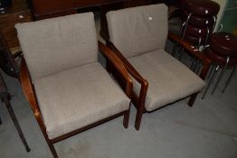 A pair of vintage stained frame waiting chairs , in cream upholstery