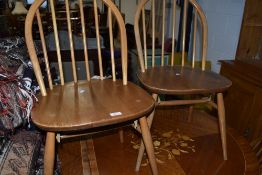 A set of of four beech hoop and stick back kitchen chairs, probably Ercol