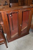 A late Victorian mahogany bookcase top, having applique glass doors, w 96cm