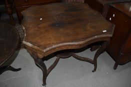 A Victorian mahogany occasional table having shaped top and inlay decoration