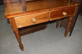 A traditional pine side table in the Victorian style , width approx.107cm