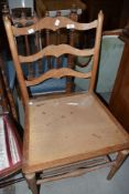 A traditional ladder back kitchen chair