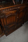A modern oak period distressed style TV cabinet/cupboard, w 80cm