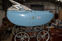 A child's vintage doll's pram and a child's vintage 'Gee Gee Rocker'