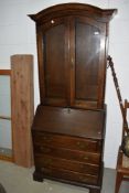 A reproduction oak bureau bookcase in the Georgian style