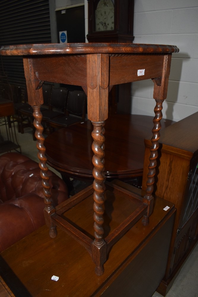 An early C20th oak twist leg occasional table