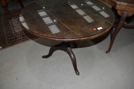 A 19th Century oak pedestal table having circular top, with protective glass, diameter approx. 80cm