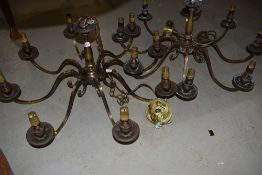 A pair of brass ceiling light fittings