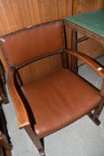 An early/mid C20th oak frame low seat armchair
