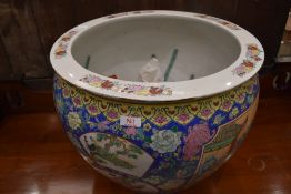 A large reproduction Chinese fish bowl, having pictorial decoration