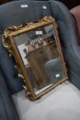 A vintage resin gilt effect wall mirror, approx 48 x 34cm