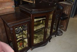 A late Victorian mahogany chiffonier base having bow front and applique decoration on cabriole legs