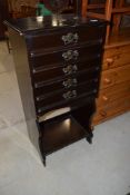 A late 19th or early 20th Century mahogany music cabinet