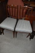 A pair of Edwardian mahogany and inlaid salon chairs