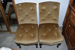 A pair of 1960's upholstered low seat bedroom chairs on cabrriole legs