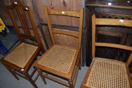 A pair of early C20th stained frame bedroom chairs and a similar chair