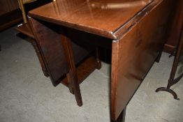 A C19th mahogany drop leaf dining table in the Georgian style, w 103cm