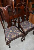 A pair of early C20th mahogany Q Anne style dining chairs
