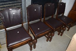A set of early/mid C20th oak frame dining chairs having upholstered stud backs, and cup and cover
