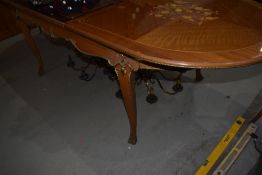 A reproduction Louis XV style dining table